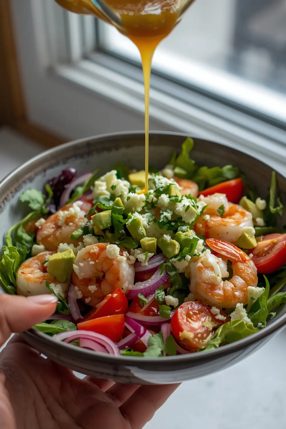 A fresh and delicious shrimp and avocado taco salad in a bowl